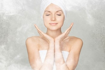 Woman standing in steam shower