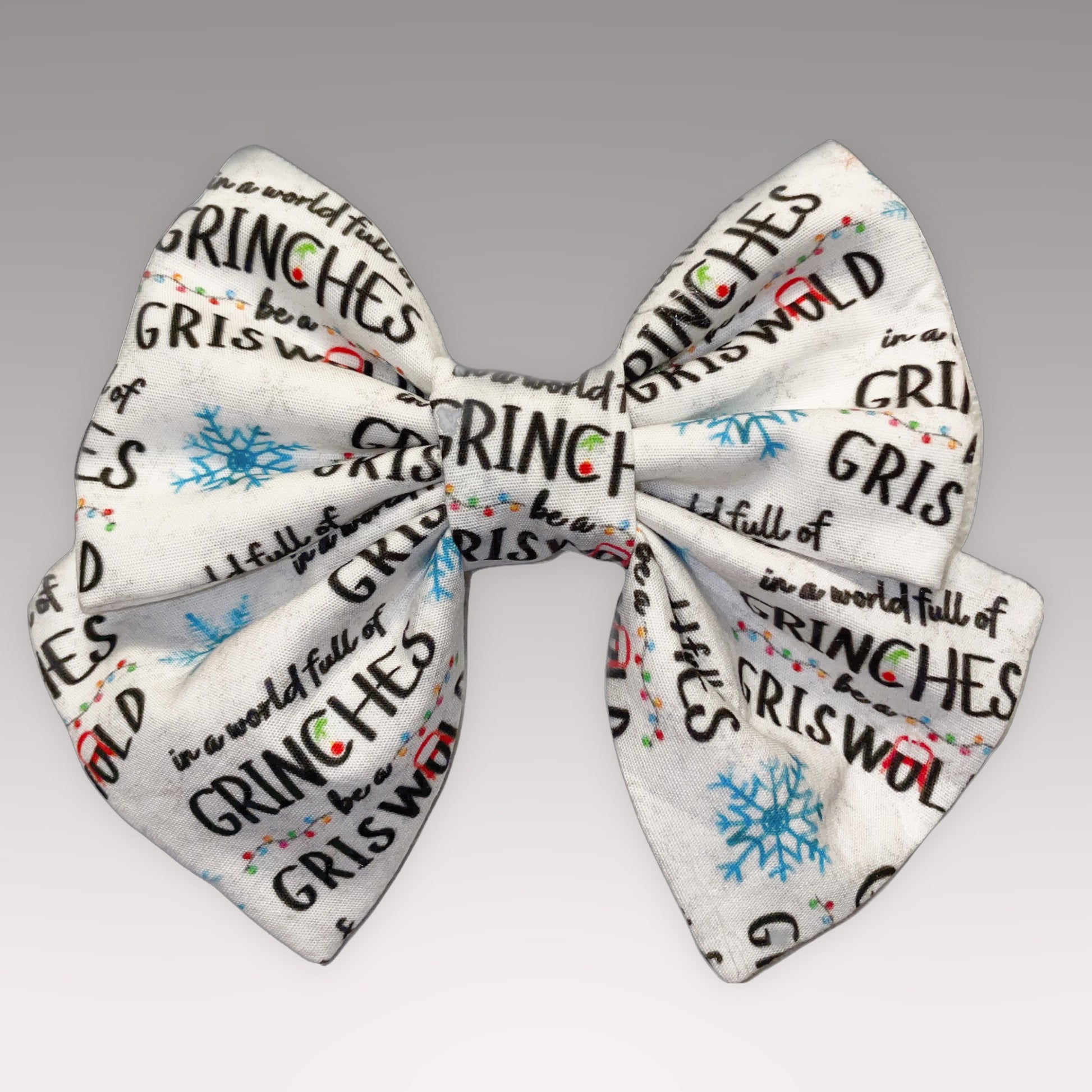 white with blue snowflakes and black font "Be a Griswold" Cotton Sailer Necktie  | Okoboji Soap Company