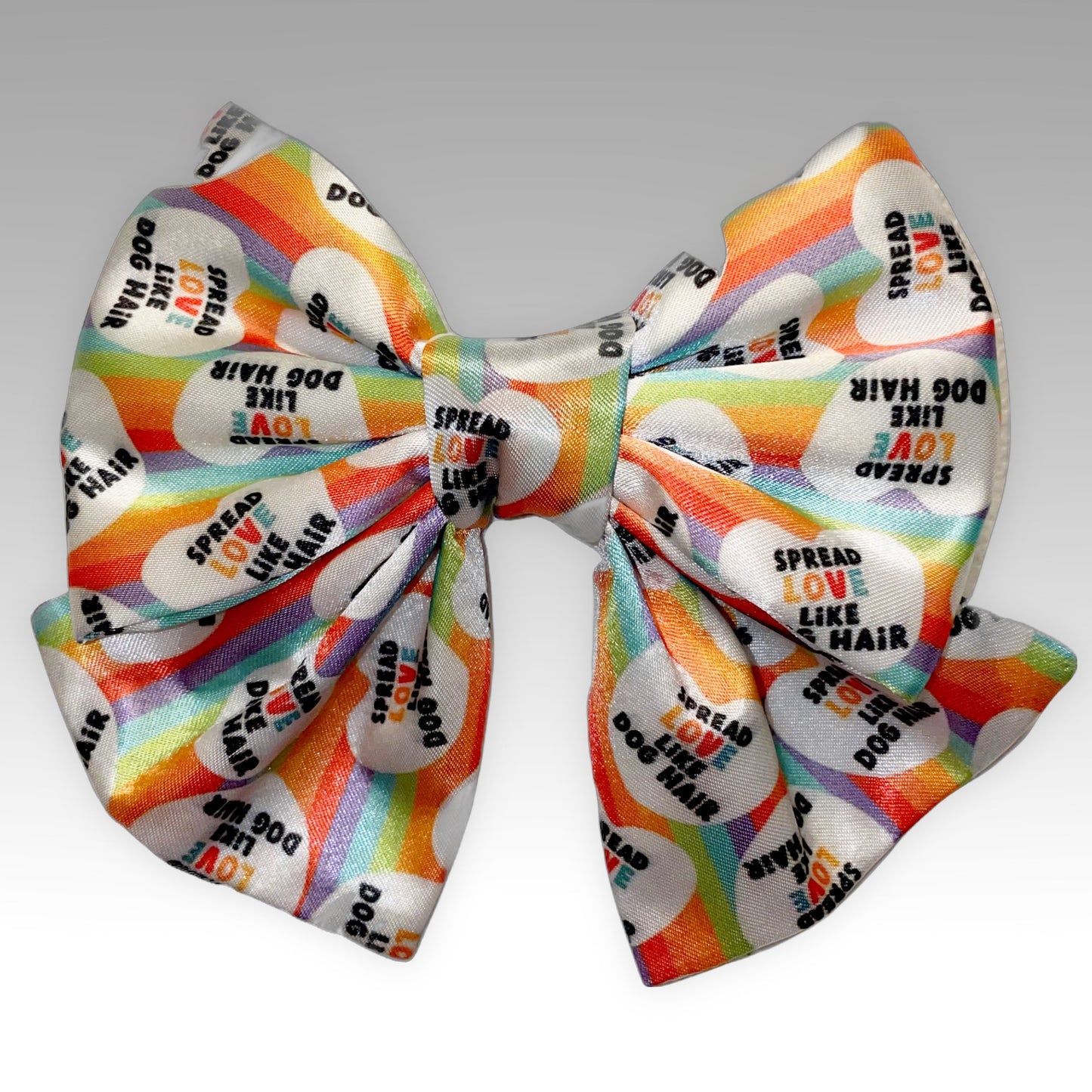 Pet Bowtie front view with words "Spread love like dog hair" rainbow colored Sailer Necktie