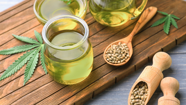 Hemp oil seeds and leaves sitting on wooden tray | Okoboji Soap Company