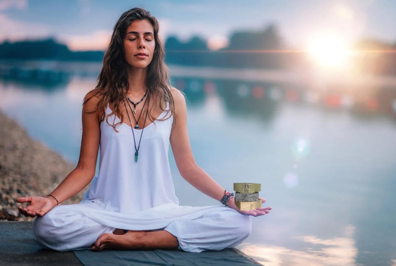 woman meditating with soap in her hand